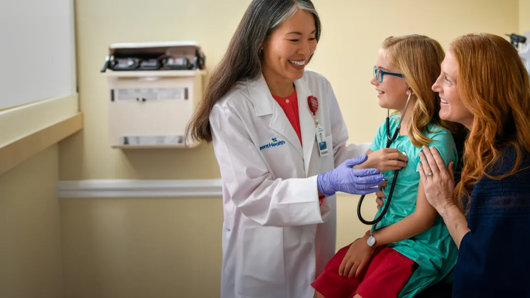 Centra Care Provider Shows a Young Patient How to Listen to Her Heart Beat