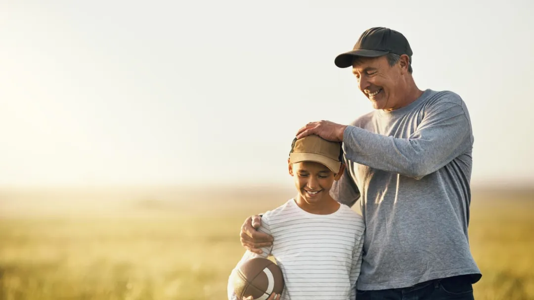 Father and Son Playing Football.
