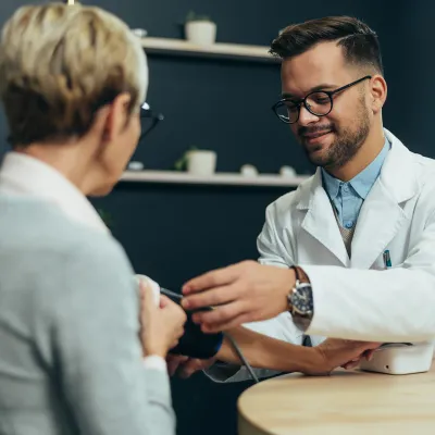 A Provider Check's a Patient's Blood Pressure