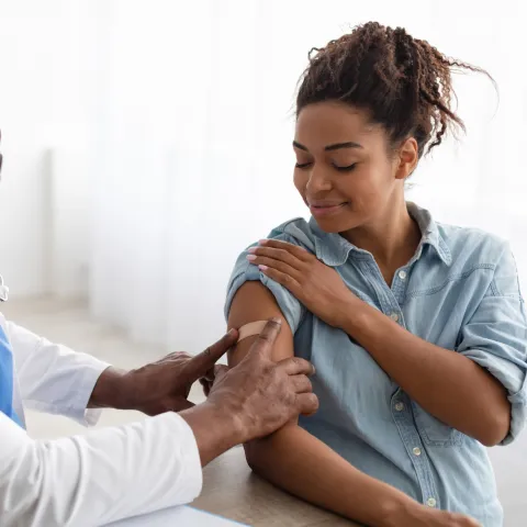 A Doctor Put on a Bandage After Giving an Injection