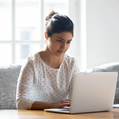 A woman doing research online.