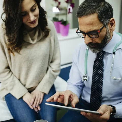 Woman discussing treatment with doctor