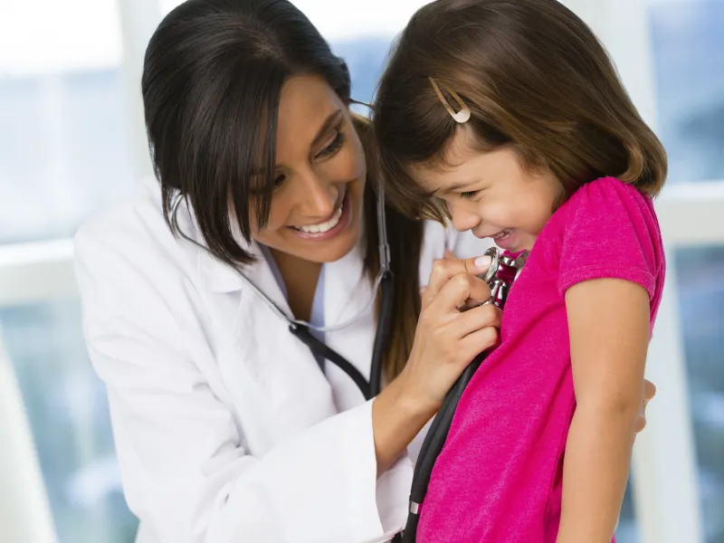 Little girl giggling at doctor's office