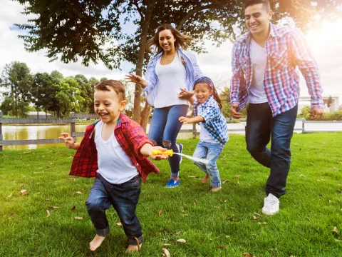 Happy family outdoors.